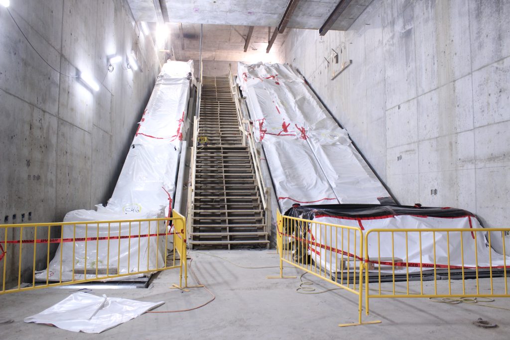 Escalators connecting future Millennium Line platform to Canada Line platform.